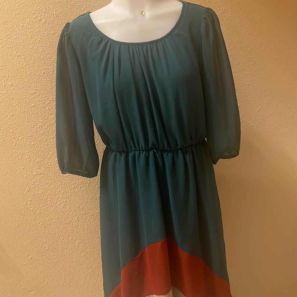 Green mini dress with long sleeves